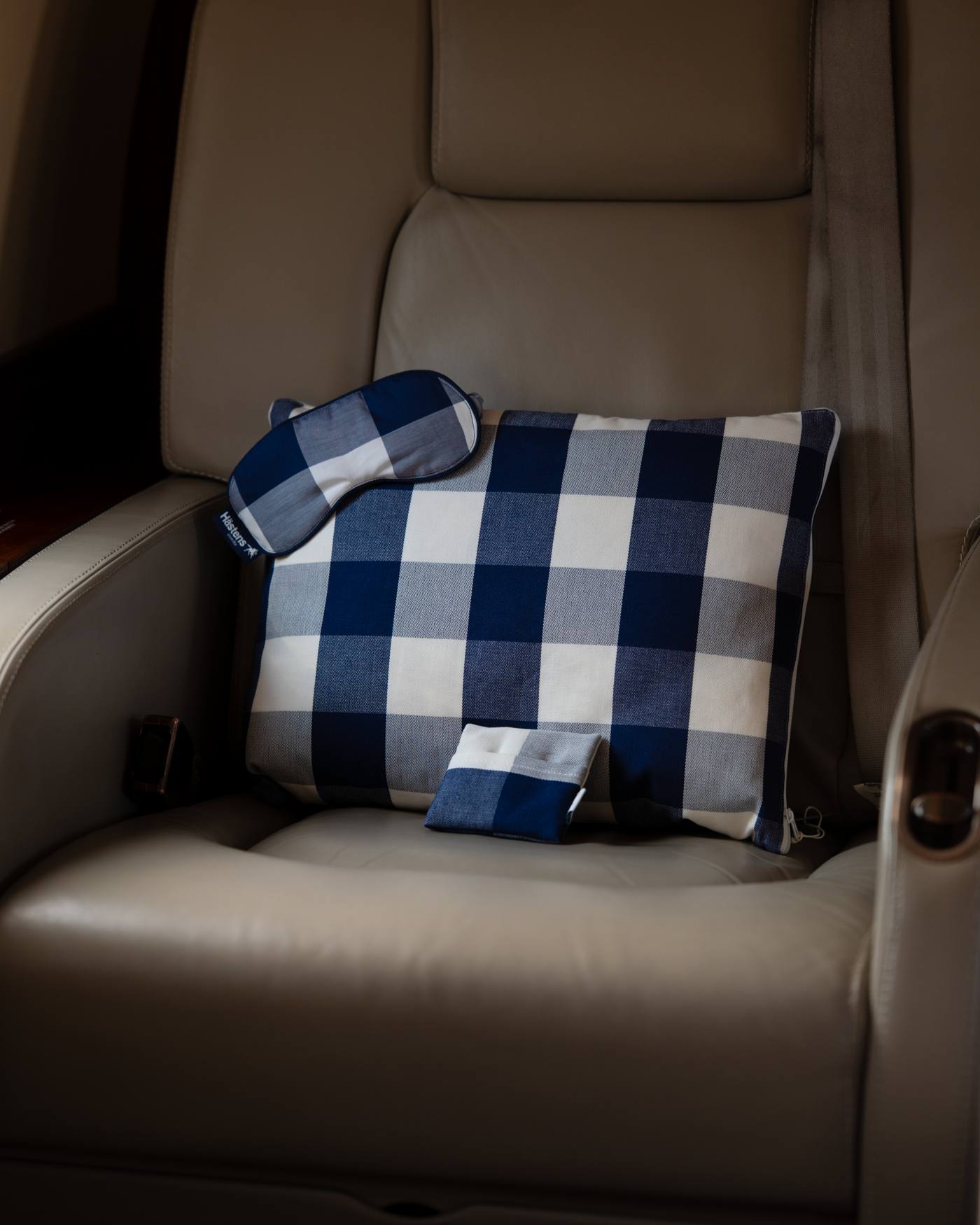 Hästens check pillow on a Helios cabin seat